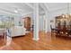 Open-concept living area with hardwood floors, bright lighting, and lovely archways at 1407 Congressional Blvd, Summerville, SC 29483