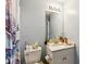 A blue-toned bathroom with a toilet and marble-look vanity at 1452 Water Edge Dr, Charleston, SC 29492