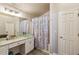A bathroom with a glass vessel sink and white vanity at 1452 Water Edge Dr, Charleston, SC 29492