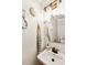 Unique bathroom with decorative wall art, a stylish mirror, and a vessel sink at 1452 Water Edge Dr, Charleston, SC 29492