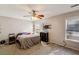 A bedroom with a ceiling fan and two windows at 1452 Water Edge Dr, Charleston, SC 29492