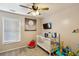 Bedroom featuring a ceiling fan, gray and white color scheme, crib, and decor for a comfortable space at 1452 Water Edge Dr, Charleston, SC 29492