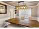 Elegant dining room featuring a large wooden table, comfortable seating, and stylish lighting at 1452 Water Edge Dr, Charleston, SC 29492