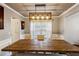 Tastefully decorated dining room showcasing a wooden table, upholstered chairs, and modern light fixture at 1452 Water Edge Dr, Charleston, SC 29492