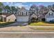 Inviting two-story home with a two-car garage and well-maintained front lawn in a friendly neighborhood at 1452 Water Edge Dr, Charleston, SC 29492