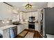 Modern kitchen featuring stainless steel appliances, white cabinets, and stylish countertops at 1452 Water Edge Dr, Charleston, SC 29492