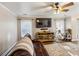 Bright living room showcasing a large television, wooden entertainment center, and comfortable seating at 1452 Water Edge Dr, Charleston, SC 29492