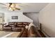 Comfortable living room with a large brown leather sofa and patterned rug at 1452 Water Edge Dr, Charleston, SC 29492