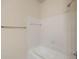 White tiled bathtub in bathroom features a shower head, and a towel rack at 1600 Long Grove Dr # 1313, Mount Pleasant, SC 29466
