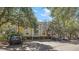 Apartment building featuring trees, parking spaces, and balconies at 1600 Long Grove Dr # 1313, Mount Pleasant, SC 29466