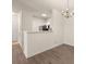 Open-concept of living room and kitchen features hardwood floors and a chandelier at 1600 Long Grove Dr # 1313, Mount Pleasant, SC 29466