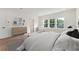 Bedroom featuring hardwood floors, white walls, and three large windows with furnishings at 1640 Siloh Siloh Dr # 477, Mount Pleasant, SC 29466