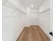 Walk-in closet with hardwood floors and shelving at 1640 Siloh Siloh Dr # 477, Mount Pleasant, SC 29466