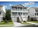 Charming two-story home featuring a double front porch, a lush lawn, and a two-car garage at 1640 Siloh Siloh Dr # 477, Mount Pleasant, SC 29466