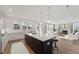 Open kitchen overlooking the living room with large island and stainless appliances at 1640 Siloh Siloh Dr # 477, Mount Pleasant, SC 29466