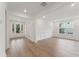 Spacious living area with hardwood floors and a stylish white paneled accent wall at 1640 Siloh Siloh Dr # 477, Mount Pleasant, SC 29466