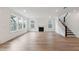 Bright, open living room features a fireplace, hardwood floors, and large windows at 1640 Siloh Siloh Dr # 477, Mount Pleasant, SC 29466