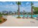 Beautiful pool area with comfortable lounge chairs, palm trees, and modern architecture, perfect for relaxation at 1640 Siloh Siloh Dr # 477, Mount Pleasant, SC 29466