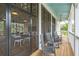 Relaxing porch with rocking chairs, wood floors, and views of the indoor lounge, offering a serene retreat at 1640 Siloh Siloh Dr # 477, Mount Pleasant, SC 29466