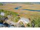 Stunning aerial view highlighting the property's waterfront location and gorgeous natural surroundings at 1717 Vireo Ct, Johns Island, SC 29455