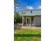 View of a covered back porch that leads to a quaint yard surrounded by greenery, offering a private outdoor retreat at 1735 Boone Hall Dr # K14, Charleston, SC 29407