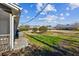 Backyard featuring a grassy area and buildings in the distance at 1735 Boone Hall Dr # K14, Charleston, SC 29407