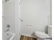 Clean bathroom featuring tile, a shower-tub combo, toilet and door at 1735 Boone Hall Dr # K14, Charleston, SC 29407