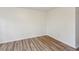 Clean bedroom featuring wood-look flooring, neutral walls, and two electrical outlets at 1735 Boone Hall Dr # K14, Charleston, SC 29407