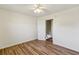Spacious bedroom featuring wood-look flooring and a doorway leading to an additional space at 1735 Boone Hall Dr # K14, Charleston, SC 29407