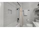 Bright bathroom featuring white subway tile, modern fixtures, and a bathtub with shower at 1836 Mepkin Rd # D4, Charleston, SC 29407