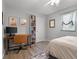 Inviting bedroom featuring a built-in bookshelf, a cozy desk, and natural light from the window at 1836 Mepkin Rd # D4, Charleston, SC 29407