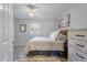 Calming bedroom with a ceiling fan, natural light, and a light wood dresser at 1836 Mepkin Rd # D4, Charleston, SC 29407