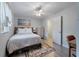 Bright bedroom with a modern ceiling fan, light-colored walls, and a cozy rug at 1836 Mepkin Rd # D4, Charleston, SC 29407