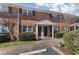Charming brick exterior of townhome featuring landscaped front yard and covered entrance at 1836 Mepkin Rd # D4, Charleston, SC 29407