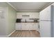 Updated kitchen featuring white cabinets, granite countertops, subway tile backsplash, and modern appliances at 1836 Mepkin Rd # D4, Charleston, SC 29407