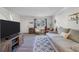 Bright living room with wood floors, area rug, light gray walls, and comfortable seating at 1836 Mepkin Rd # D4, Charleston, SC 29407