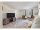Comfortable living room with neutral paint, wood-look floors, area rug, and staircase access to the next level at 1836 Mepkin Rd # D4, Charleston, SC 29407