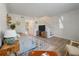 Comfortable living room with neutral paint, wood-look floors, area rug, and staircase access to the next level at 1836 Mepkin Rd # D4, Charleston, SC 29407