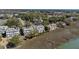Aerial view of waterfront townhomes featuring solar panels and breathtaking marsh scenery at 1902 Long Bend Dr # 1B, Seabrook Island, SC 29455