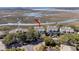 Stunning aerial view showcases a marsh-front property with mature trees, a community pier, and waterfront access at 1902 Long Bend Dr # 1B, Seabrook Island, SC 29455