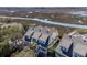 Aerial view of marsh-front property with solar panels, waterfront access, and lush surroundings at 1902 Long Bend Dr # 1B, Seabrook Island, SC 29455