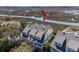 Aerial view of marsh-front property with solar panels, waterfront access, and lush surroundings at 1902 Long Bend Dr # 1B, Seabrook Island, SC 29455