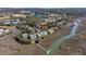 Panoramic aerial view of marsh-front property with private boat dock and community waterfront access, showcasing a desirable location at 1902 Long Bend Dr # 1B, Seabrook Island, SC 29455