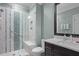 Modern bathroom with glass shower, white marble tile, and double sink at 1902 Long Bend Dr # 1B, Seabrook Island, SC 29455