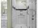 Modern bathroom showcasing a glass shower with white tile and black accents at 1902 Long Bend Dr # 1B, Seabrook Island, SC 29455
