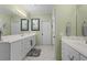 Large bathroom with double vanity sinks, mirrors and walk in shower at 1902 Long Bend Dr # 1B, Seabrook Island, SC 29455