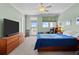 Bedroom with marsh views, wood dresser and blue bedding at 1902 Long Bend Dr # 1B, Seabrook Island, SC 29455