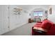 Bonus room featuring a red couch and water view at 1902 Long Bend Dr # 1B, Seabrook Island, SC 29455