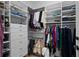 Walk-in closet with custom shelving and drawers for organization at 1902 Long Bend Dr # 1B, Seabrook Island, SC 29455