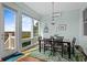 Dining area featuring marsh views, modern lighting, and seating for four at 1902 Long Bend Dr # 1B, Seabrook Island, SC 29455